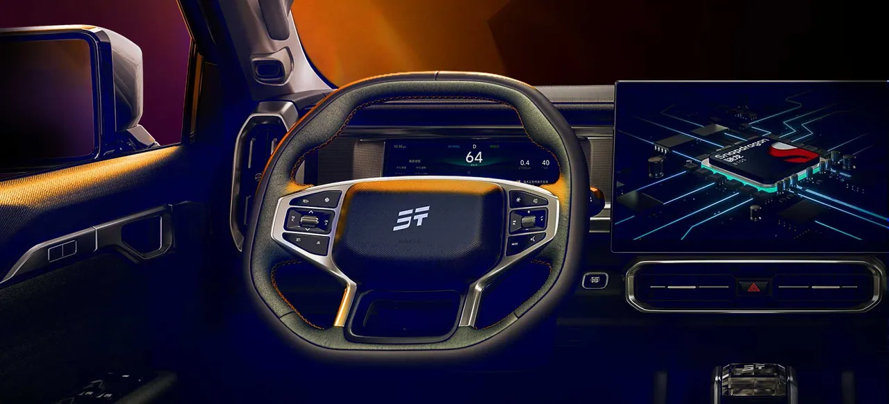 Steering wheel, digital cluster and centre screen lit at night