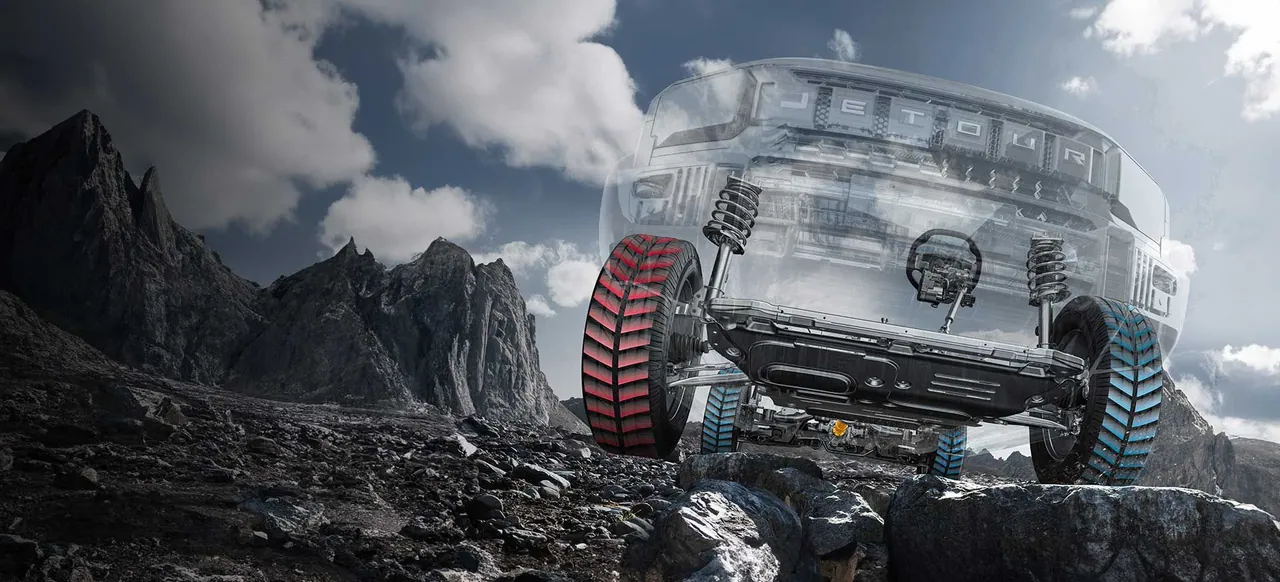 Transparent T2 on rocks with its four-wheel drive system and tyres shown inside
